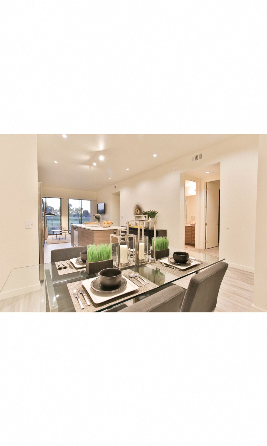 Scottsdale, AZ Apartments - Open-Concept Dining Room with Wood Flooring, Overhead Lighting, and Seamless Access to Kitchen