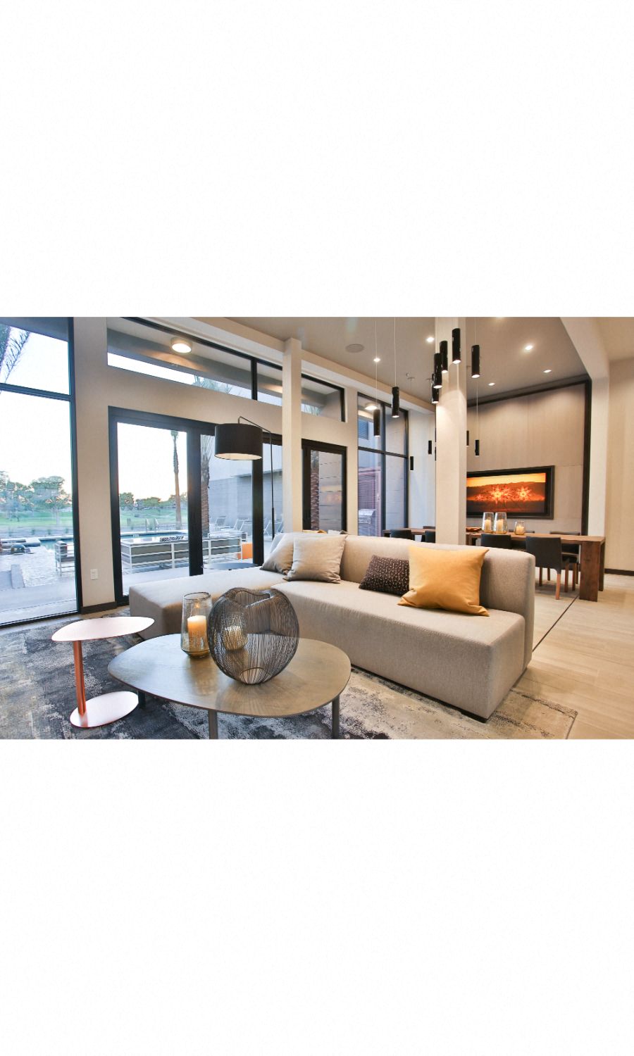 Apartments in Old Town Scottsdale, AZ - Community Clubhouse with Plush Seating, Tables, and Access to the Pool