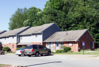 A car is parked in front of a house.