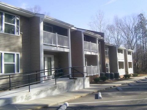 an apartment building with stairs and balconies