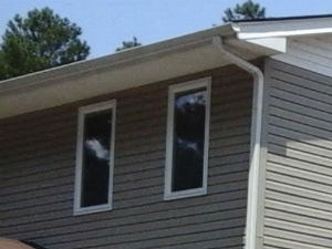 a house with a porch and a parking lot