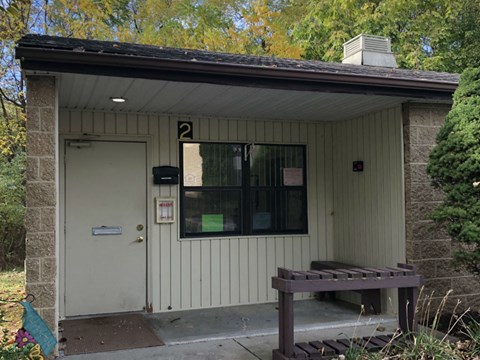 A small building with a number 2 on the front door.