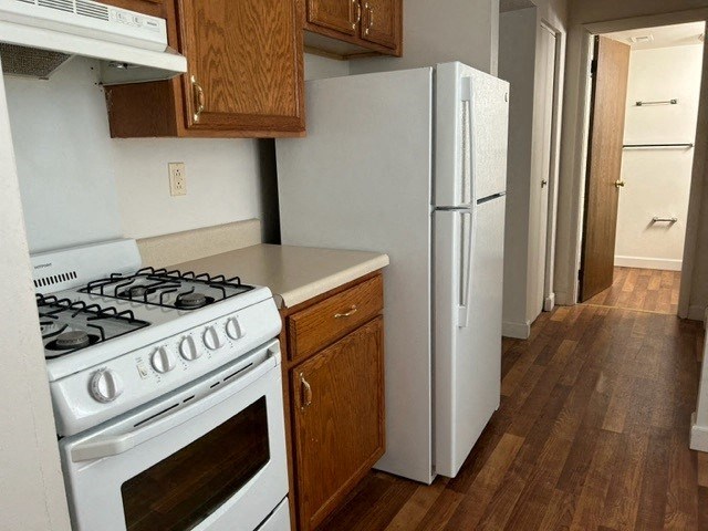 a kitchen with a stove and a refrigerator