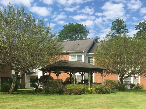 a house with a gazebo in a yard