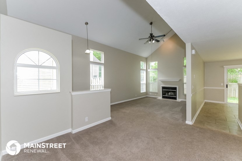 the living room and dining room with fireplace