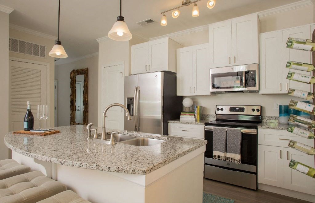 a kitchen with a granite counter top and a sink