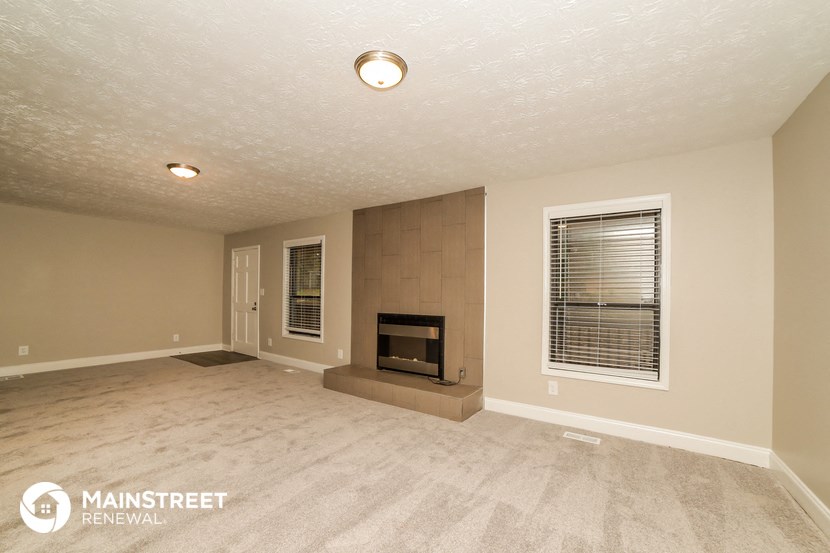 the living room of a house with a fireplace