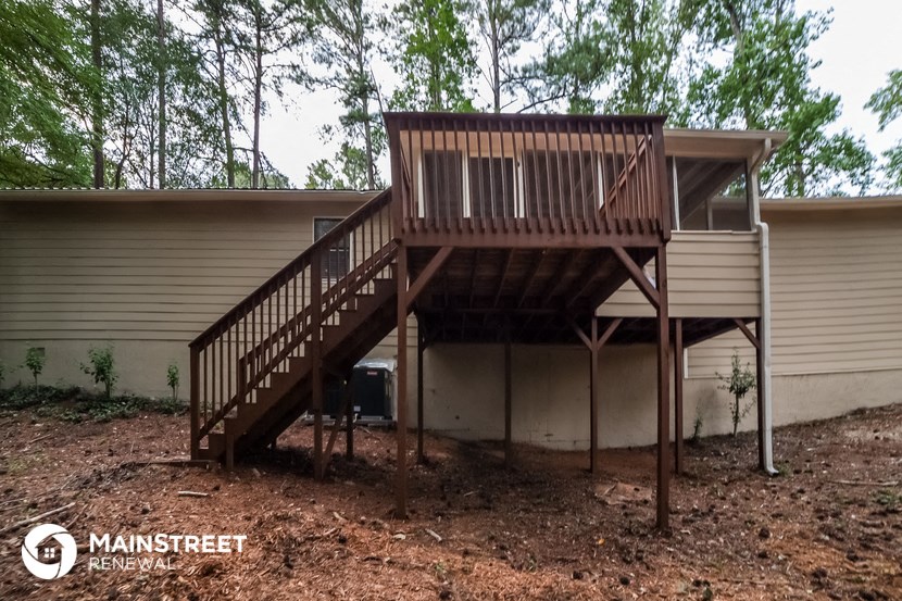 the stairs to the deck from the back of the house