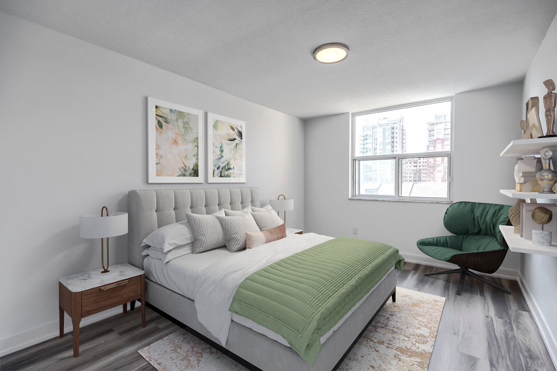 A bedroom with a large bed and a green chair.