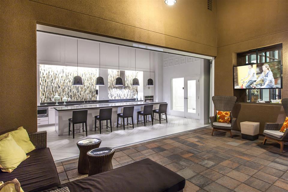 a living room with a bar and a couch