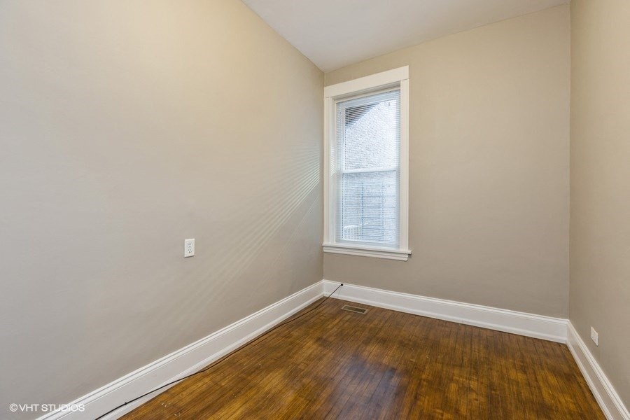 Bright bedroom with hardwood floors