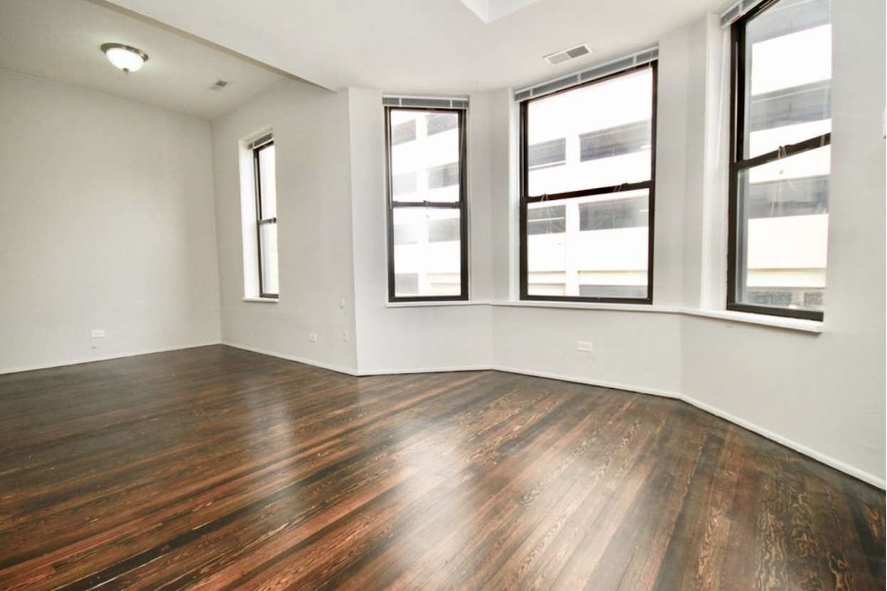 Large windows in the living room and dining area