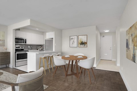 A modern kitchen with a dining table and chairs.