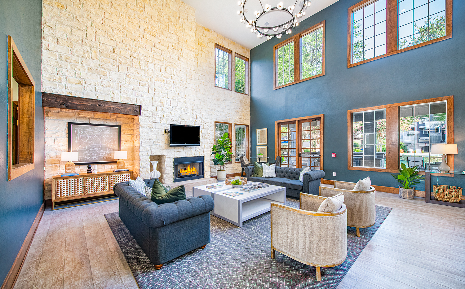 a living room with couches and chairs and a fireplace