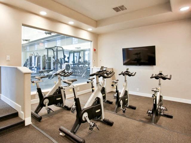 The Highland Apartments Fitness Studio with spin bikes and fitness on demand tv