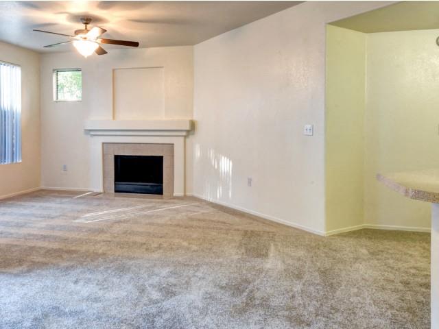 Ingleside Apartments Living Room with wall to wall carpet and fireplace