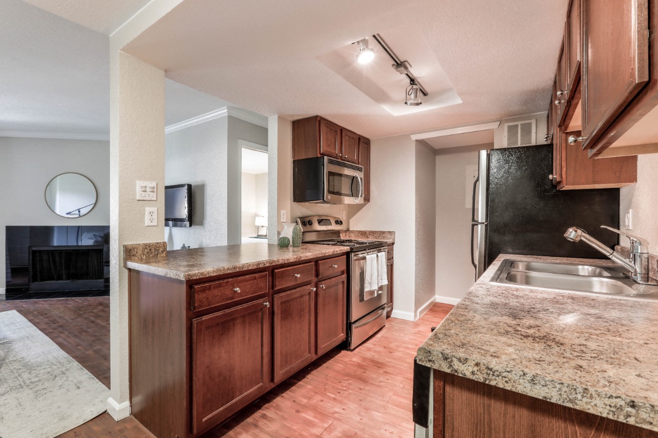 Copper Flats - Kitchen with Wood-Style Flooring, Wood-Style Cabinets, and Marble-Style Countertops