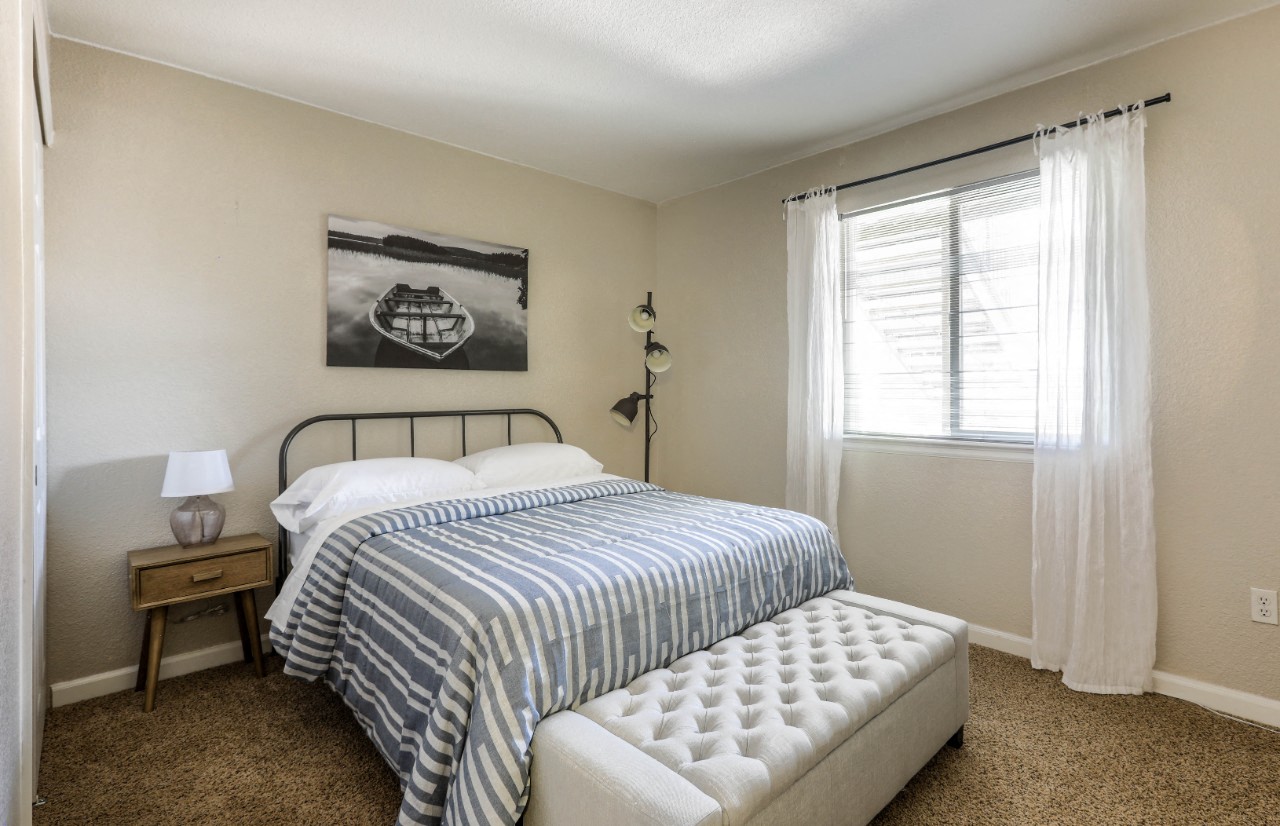 Copper Flats - Bedroom with Large Window, Spacious Closet, Full-Sized Bed, and Wall-to-Wall Plush Carpet