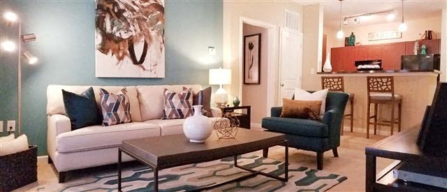 a living room with a couch and a table