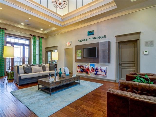 a living room with a couch and a television