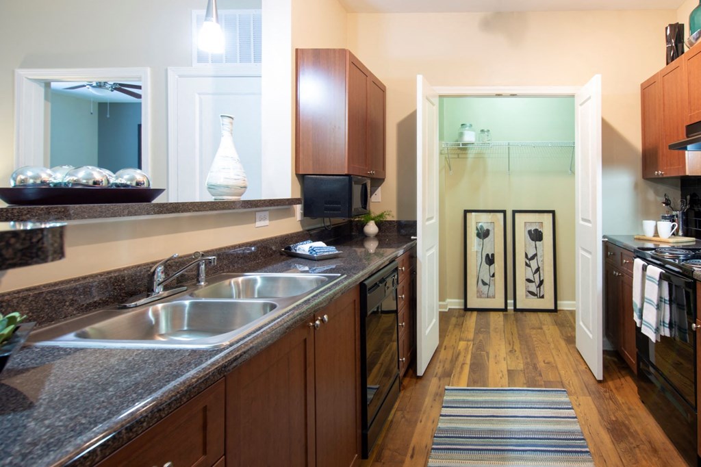 a kitchen with a large counter top and a sink