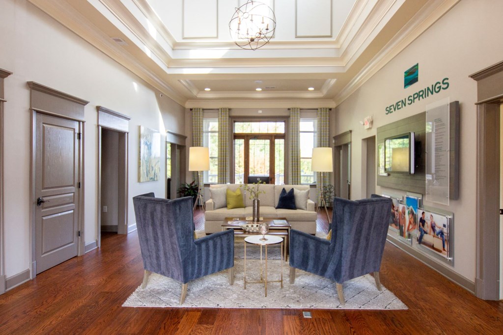a living room with a couch and chairs