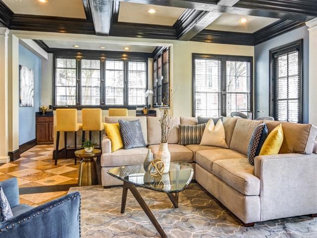 a living room with a couch and a table