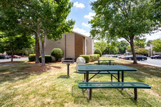 outdoor area with grill and picnic tables