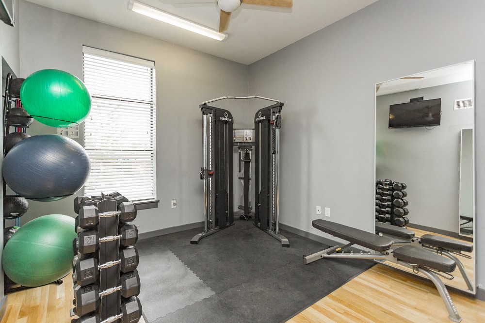 Gale Lofts Apartments Fitness Center with Ellipticals, Treadmill, and Full Body Mirrors