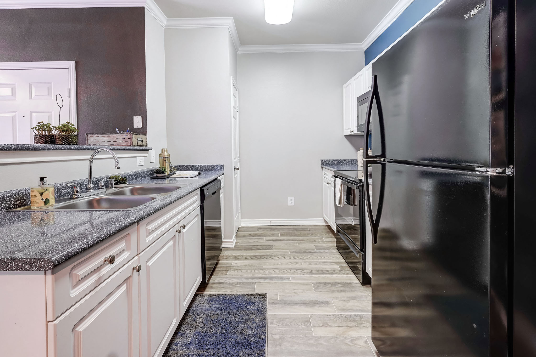 Large Eat In Kitchens with Black Appliances