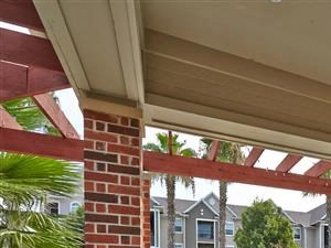 Covered poolside seating with ceiling fan