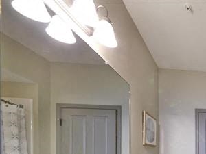 Master bathroom with large vanity, closet entrance, and soaking tub/shower