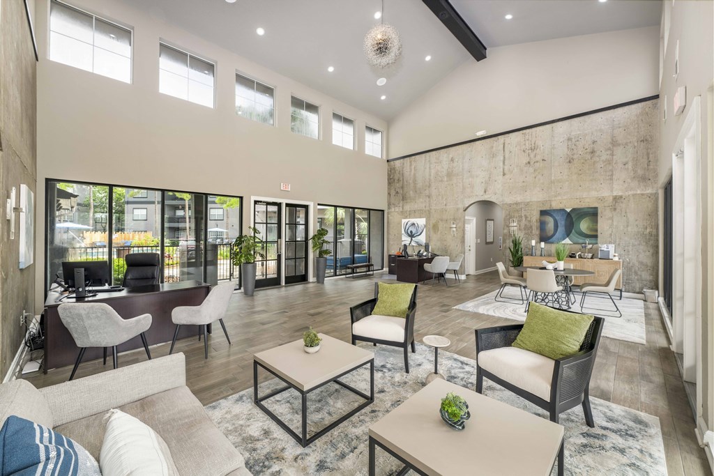 a living room with couches and chairs and a fireplace