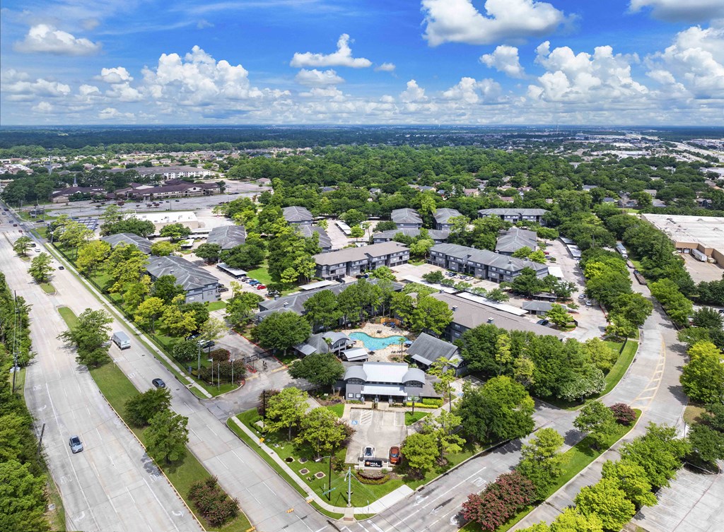 an aerial view of a neighborhood with houses and trees