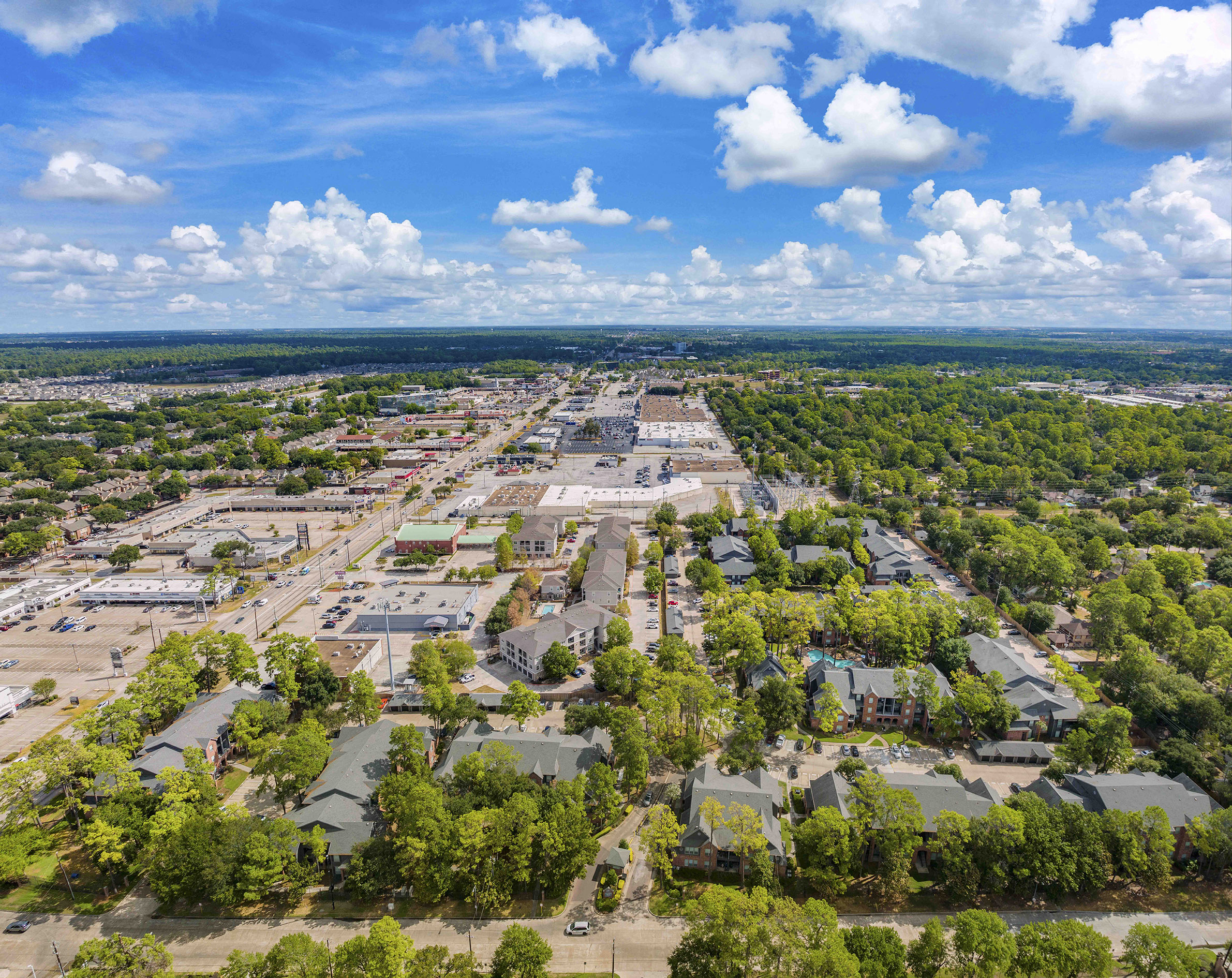 an aerial view of a neighborhood with houses and trees