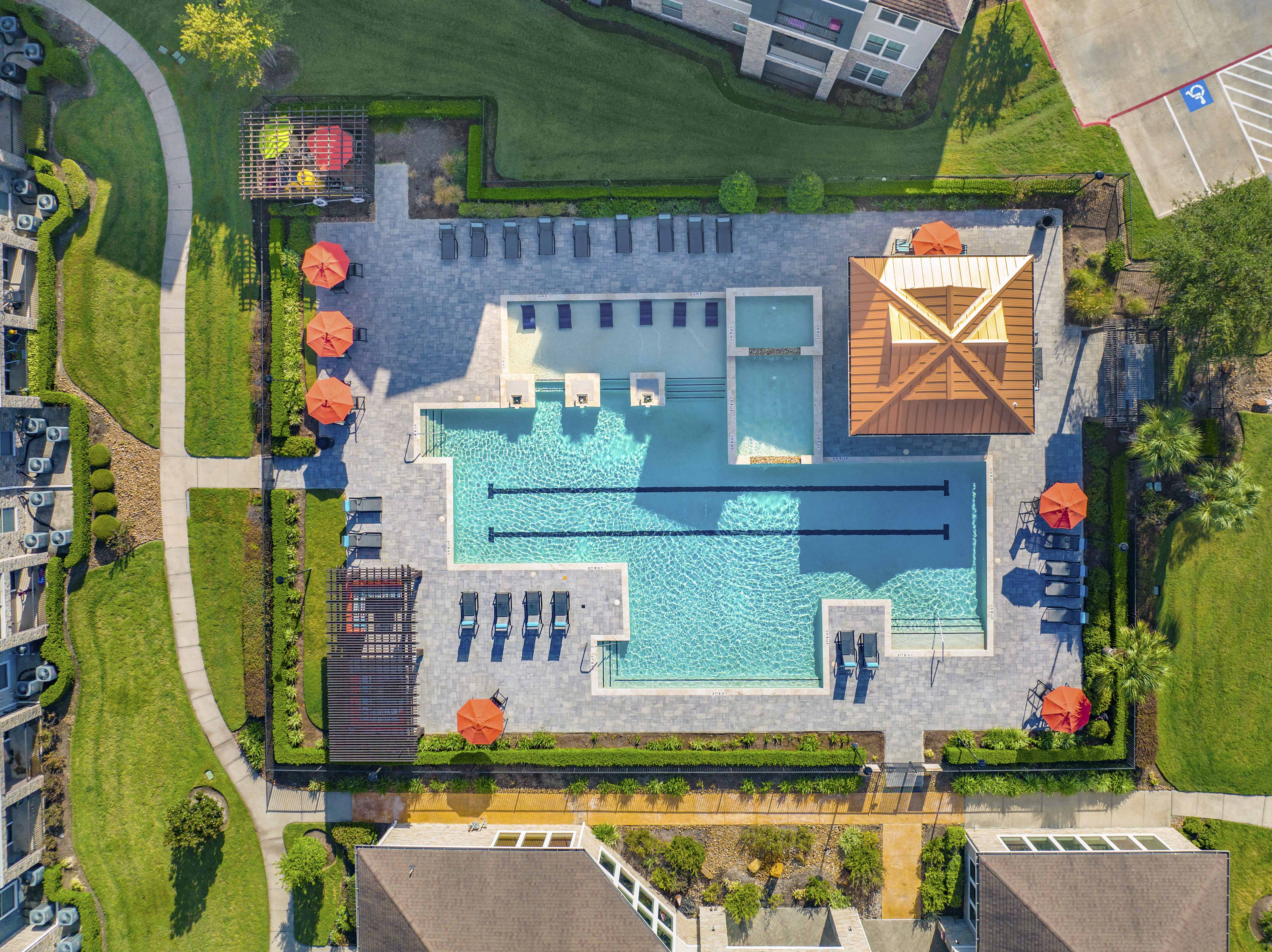 arial view of a house with a swimming pool and a backyard