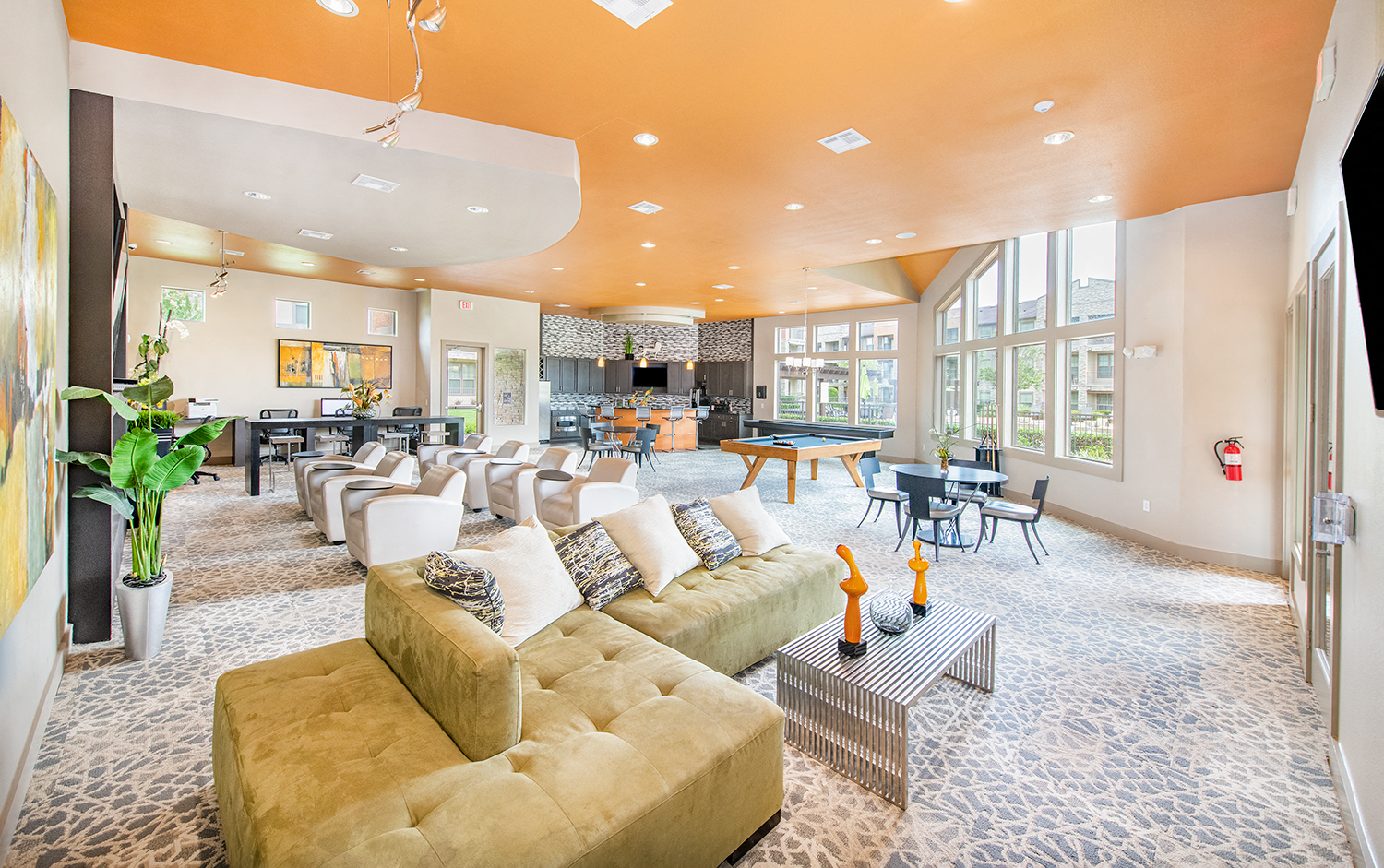 a large living room with couches and tables