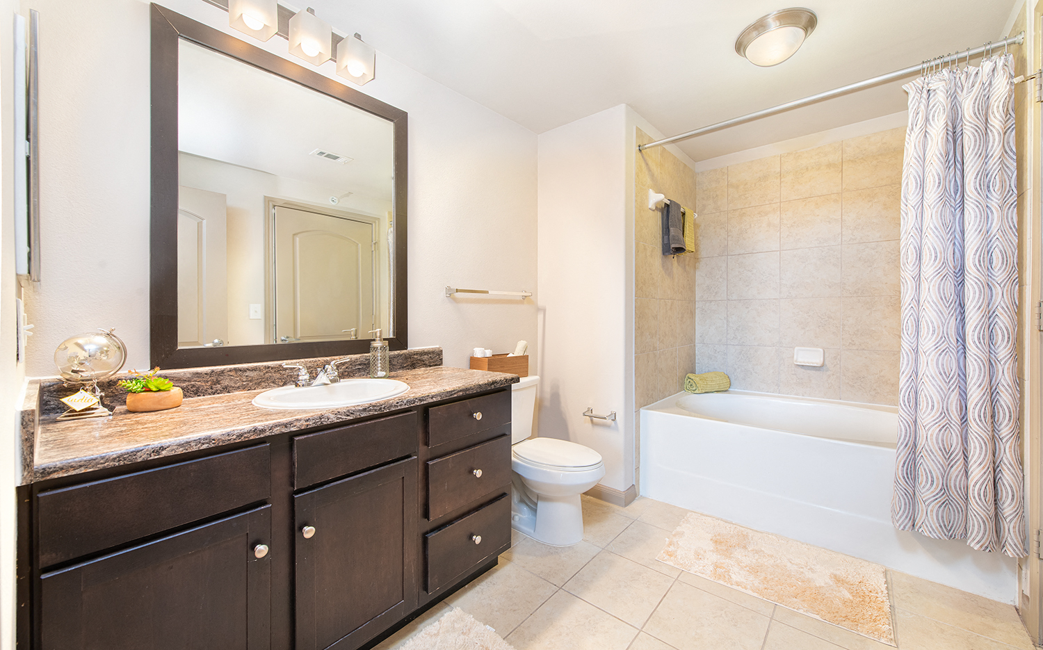 a bathroom with a sink and a toilet and a bath tub