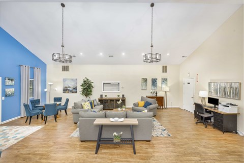 A living room with a grey sofa and a grey coffee table.