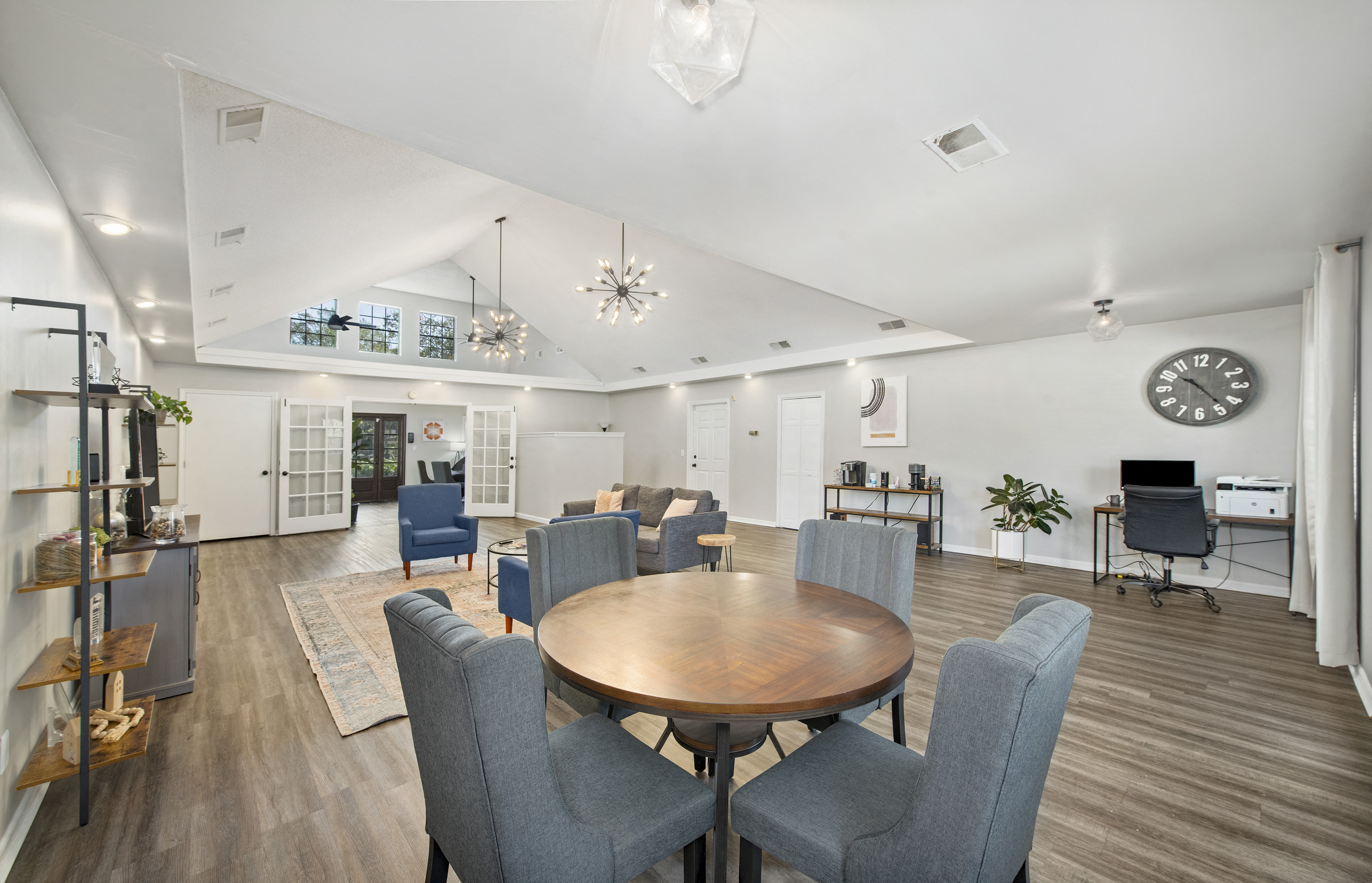 a dining room with a table and chairs and a living room