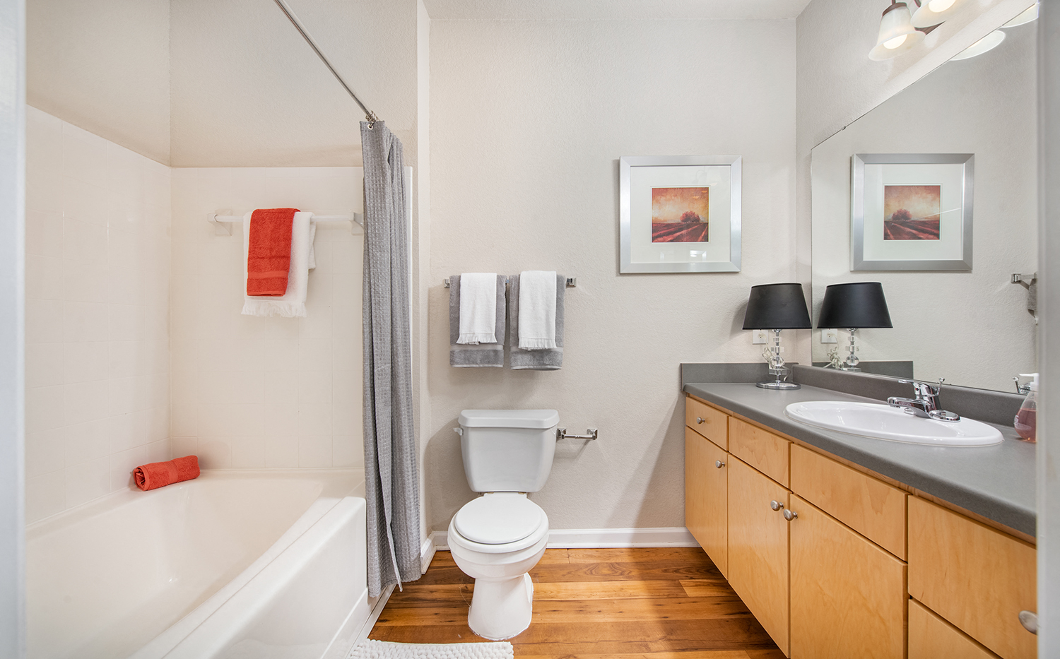 a bathroom with a toilet sink and bath tub and a shower