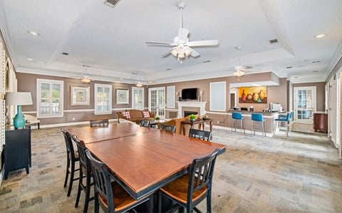 a large dining room and living room with a large table and chairs
