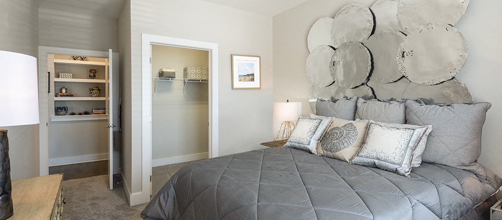 a bedroom with a bed and a closet