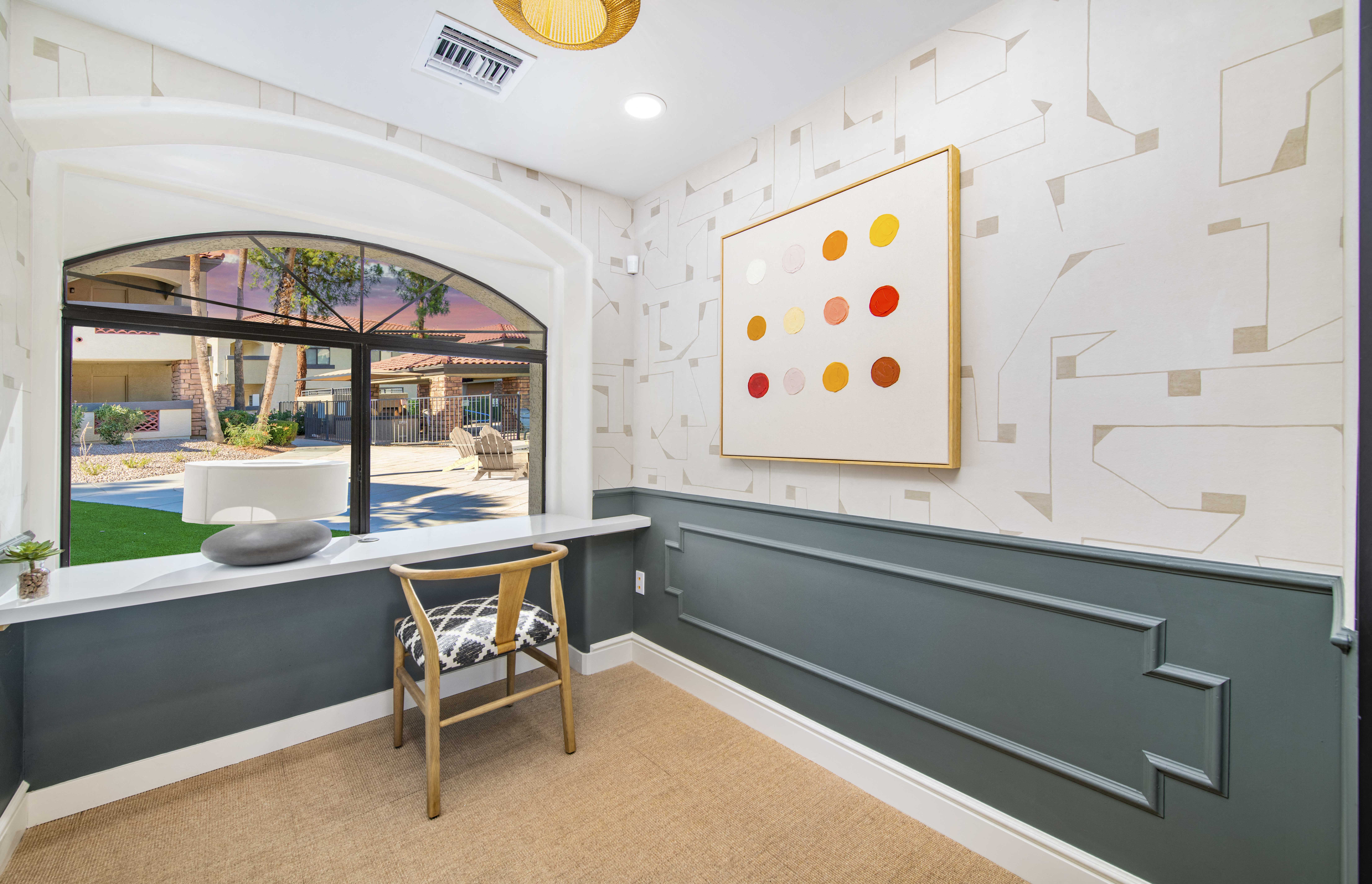 a room with a table and a chair and a window