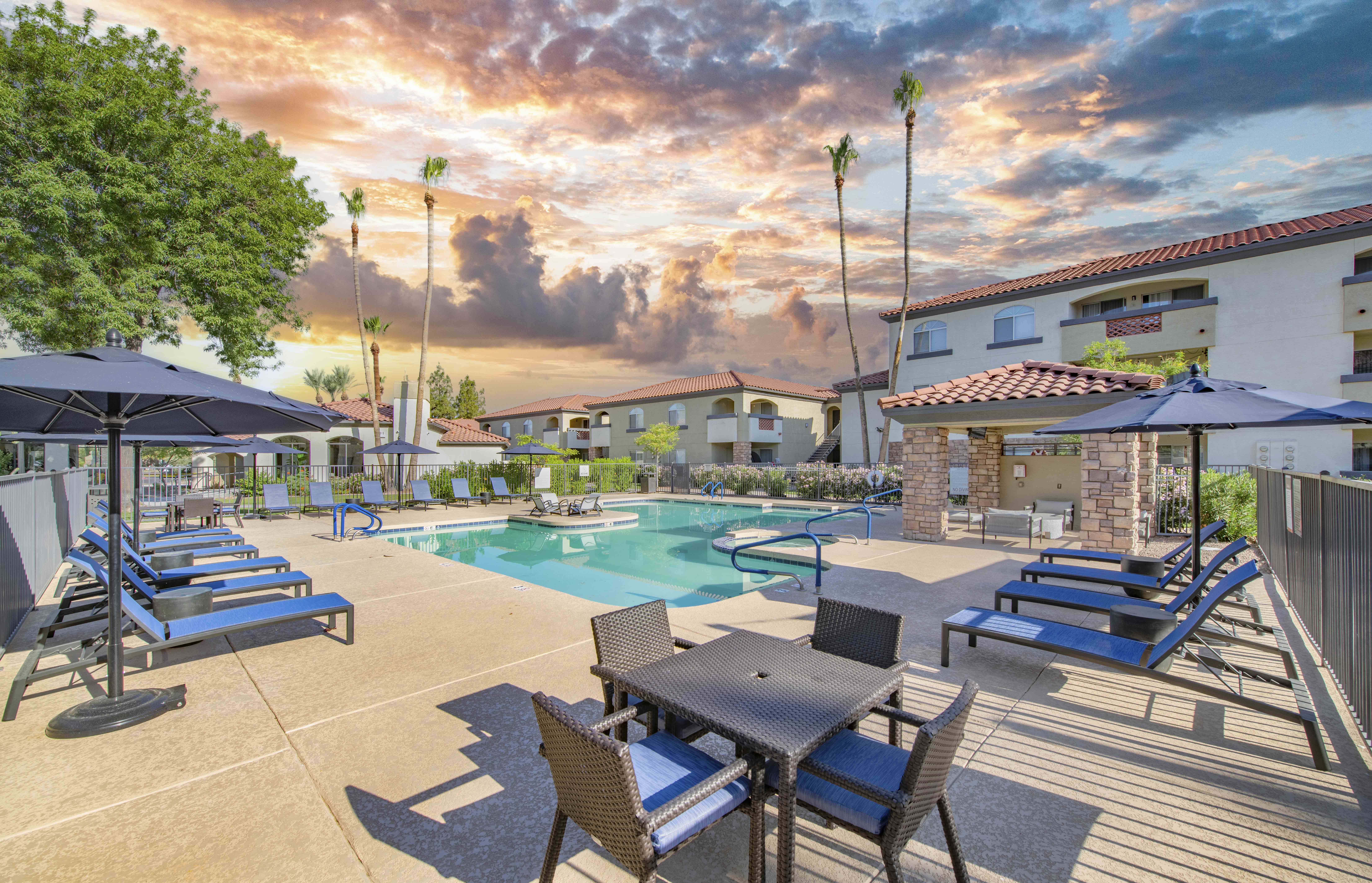 our apartments offer a swimming pool with tables and chairs