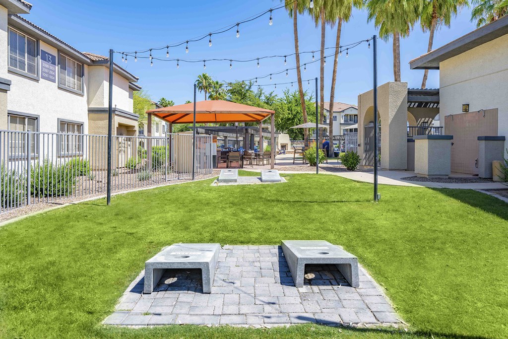our apartments have a large yard with picnic tables and umbrellas