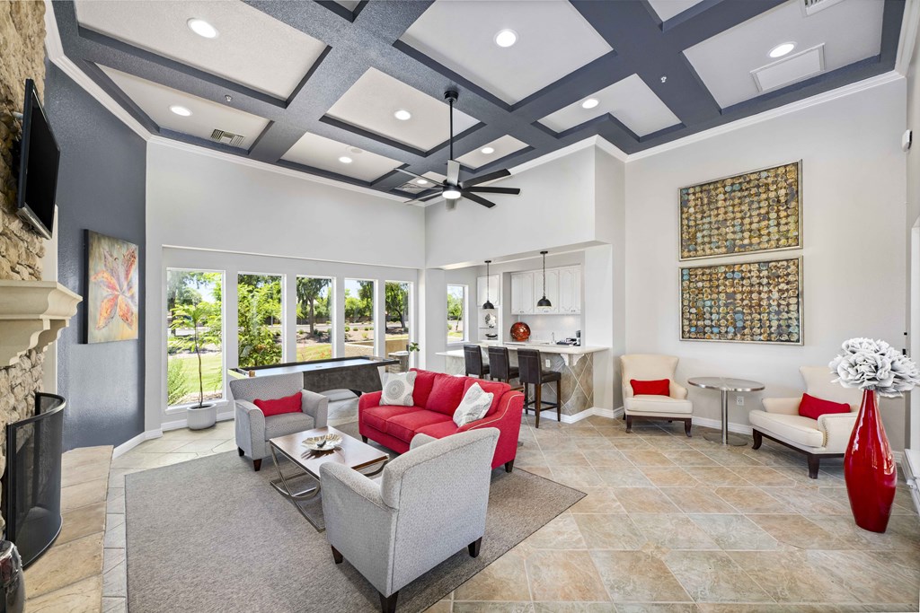 a living room with couches and chairs and a table