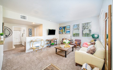 a living room with a couch and a tv