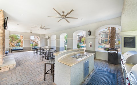 a lobby with a bar and tables with chairs
