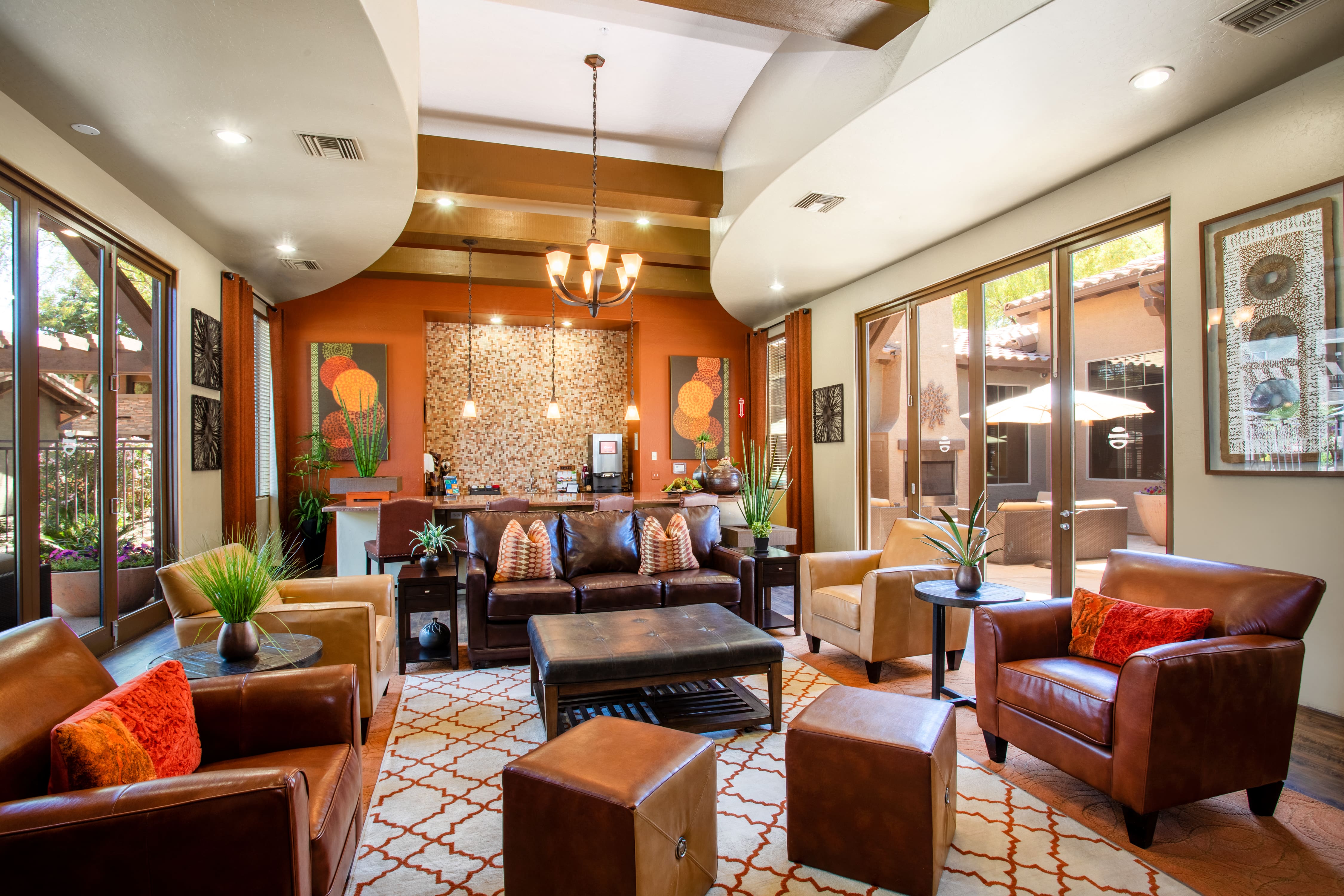 the lobby of a hotel with couches and chairs and a bar